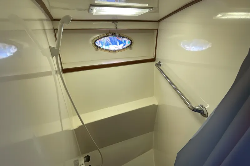 Slide: The Image of Bathroom interior of 1989 Jefferson 37 Sundeck yacht with wooden toilet seat. - 45