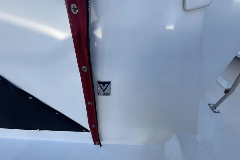 Slide: The Image of 1989 Jefferson 37 Sundeck yacht docked at marina under clear blue sky. - 8