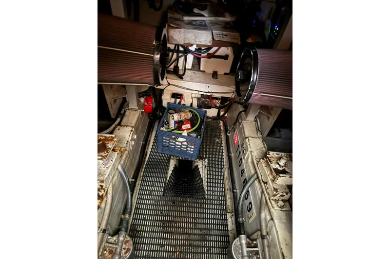 Slide: The Image of Engine room of 1991 Tiara Yachts 4300 Convertible with maintenance supplies. - 22