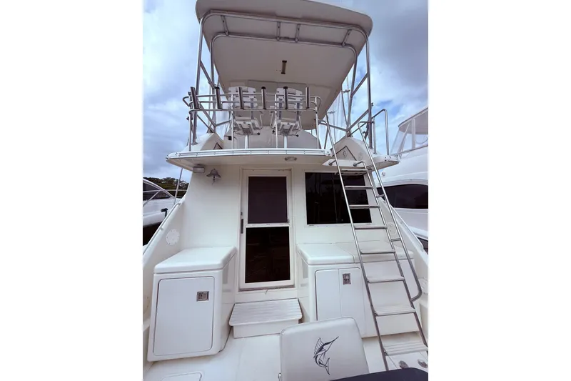 Slide: The Image of 1991 Tiara Yachts 4300 Convertible, rear view with ladder and upper deck. - 29