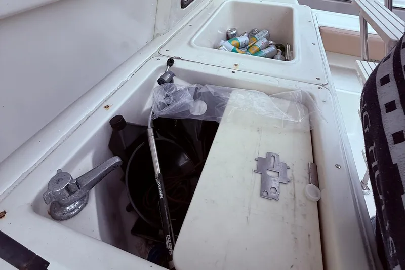 Slide: The Image of Storage compartments on a 1991 Tiara Yachts 4300 Convertible, containing drinks and equipment. - 3