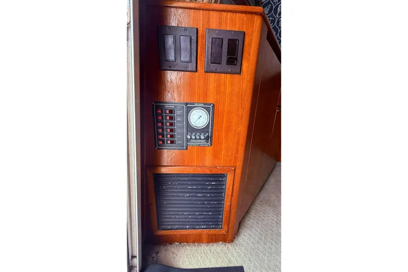 Slide: The Image of 1991 Tiara Yachts 4300 Convertible interior control panel with wood finish. - 34
