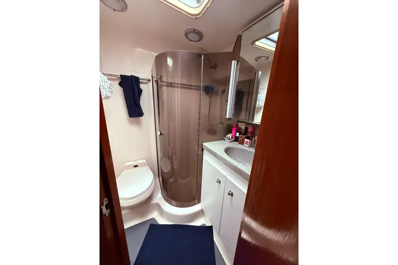 Slide: The Image of Bathroom interior of 1991 Tiara Yachts 4300 Convertible with shower and vanity. - 35