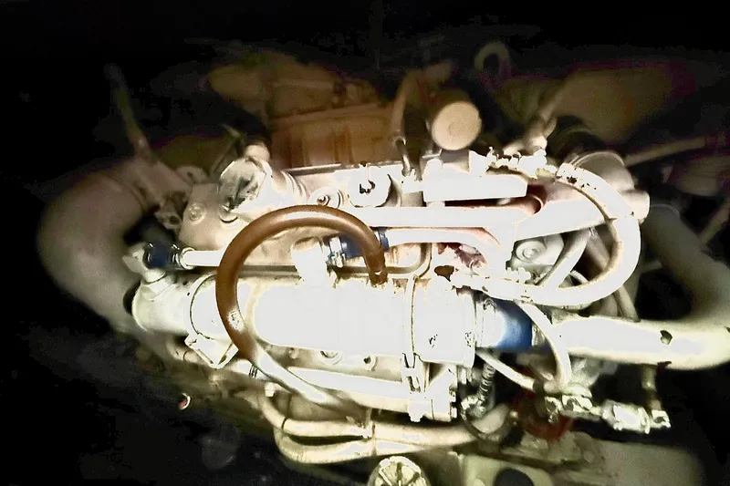Slide: The Image of Engine of a 1991 Tiara Yachts 4300 Convertible, showcasing intricate mechanical components. - 58