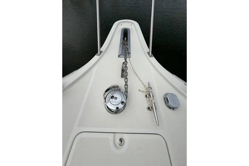 Slide: The Image of Bow of 1991 Tiara Yachts 4300 Convertible with anchor chain and cleat. - 76