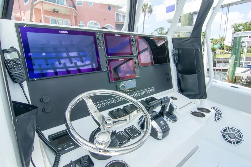 Slide: The Image of Cockpit of 2022 Freeman 37 VH boat with advanced navigation systems and controls. - 10