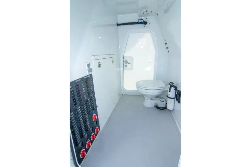 Slide: The Image of Interior of 2022 Freeman 37 VH boat featuring a compact bathroom with control panel. - 14