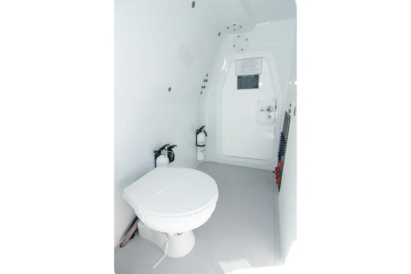 Slide: The Image of 2022 Freeman 37 VH boat interior with toilet and fire extinguisher. - 15