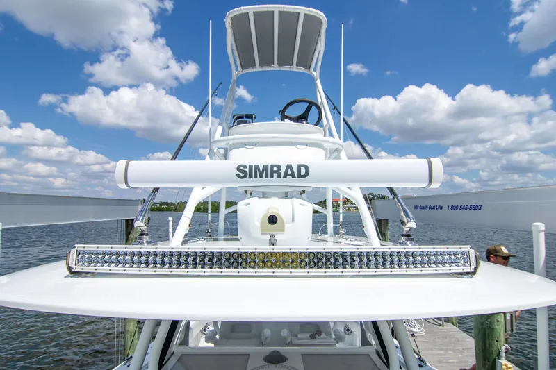 Slide: The Image of 2022 Freeman 37 VH boat with Simrad radar and LED light bar, docked under blue sky. - 16