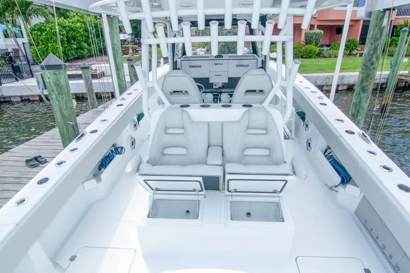 Slide: The Image of 2022 Freeman 37 VH boat interior with white seating and advanced navigation system. - 17