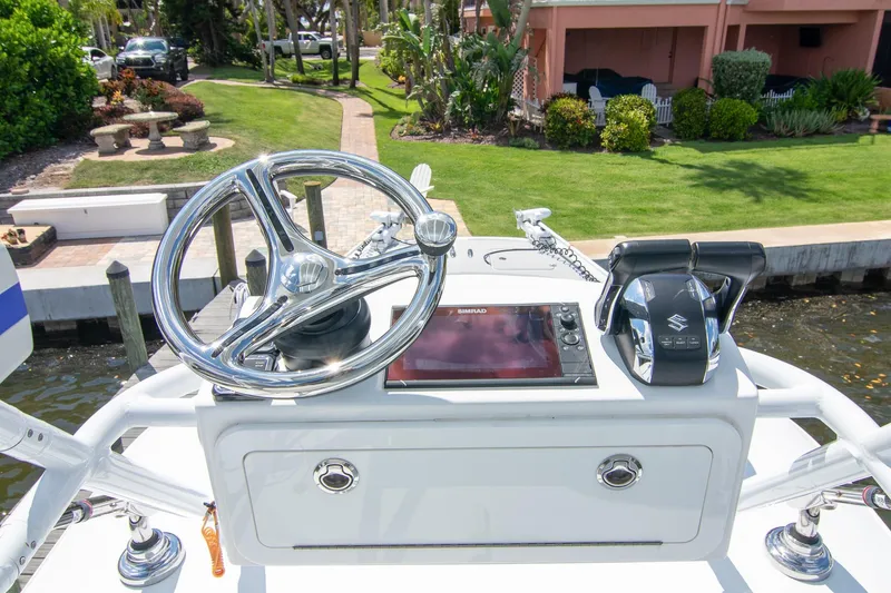 Slide: The Image of Boat helm of 2022 Freeman 37 VH with steering wheel and controls. - 21
