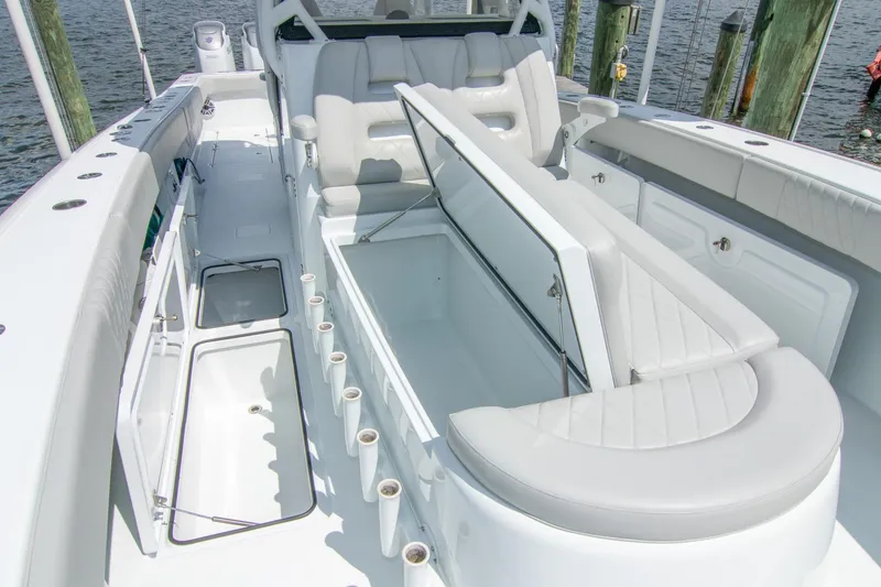 Slide: The Image of Freeman 37 VH 2022 boat interior with open storage, white seating, and rod holders. - 27