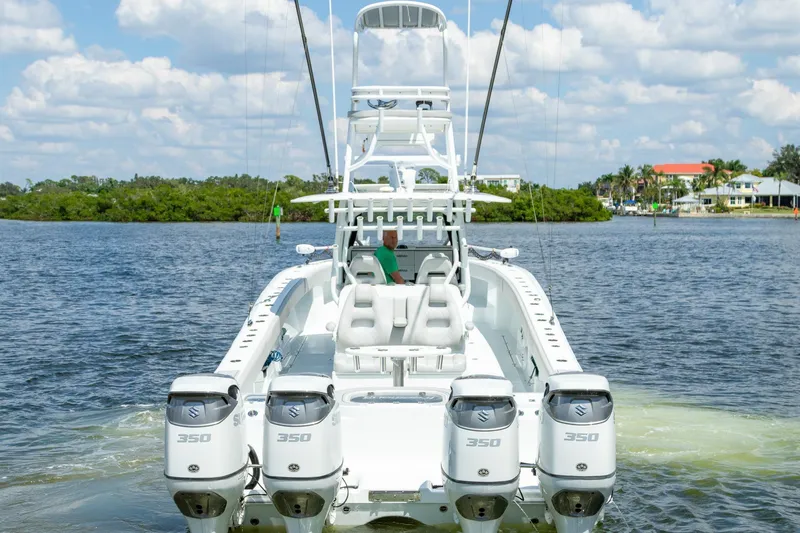 Slide: The Image of 2022 Freeman 37 VH boat with four Suzuki 350 engines on a sunny day. - 3