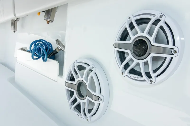 Slide: The Image of Boat speakers and coiled hose on 2022 Freeman 37 VH model. - 30