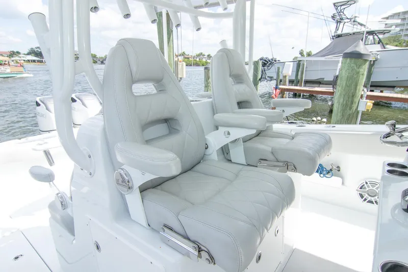 Slide: The Image of Luxury seating on 2022 Freeman 37 VH boat, docked by the water. - 32