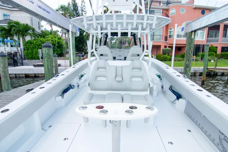 Slide: The Image of 2022 Freeman 37 VH boat interior with white seating and fishing rod holders. - 38