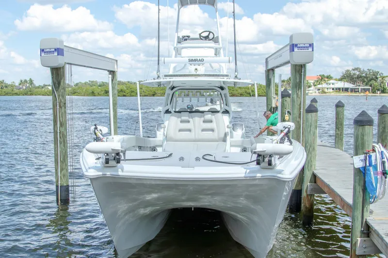 Slide: The Image of 2022 Freeman 37 VH boat docked at marina with clear skies. - 4
