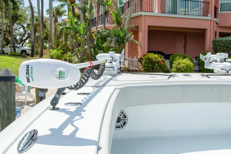 Slide: The Image of 2022 Freeman 37 VH boat with Rhodan GPS anchor, docked near tropical landscaping. - 43