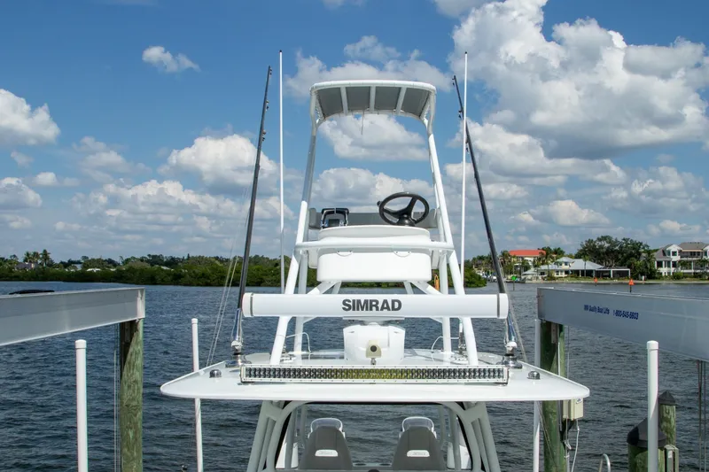 Slide: The Image of 2022 Freeman 37 VH boat docked by a scenic waterfront under a blue sky. - 45