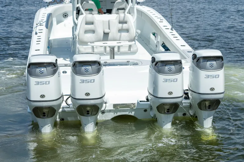 Slide: The Image of 2022 Freeman 37 VH boat with four Suzuki 350 outboard engines on water. - 47