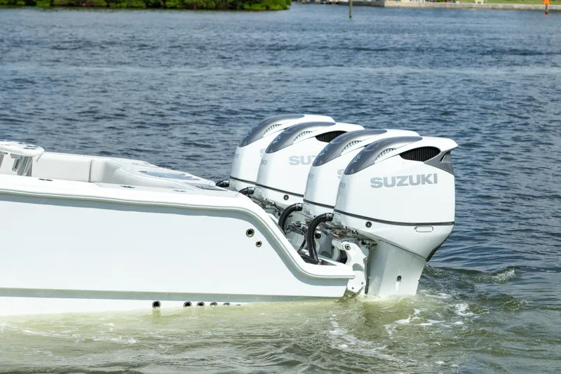 Slide: The Image of 2022 Freeman 37 VH boat with triple Suzuki outboard motors on the water. - 48