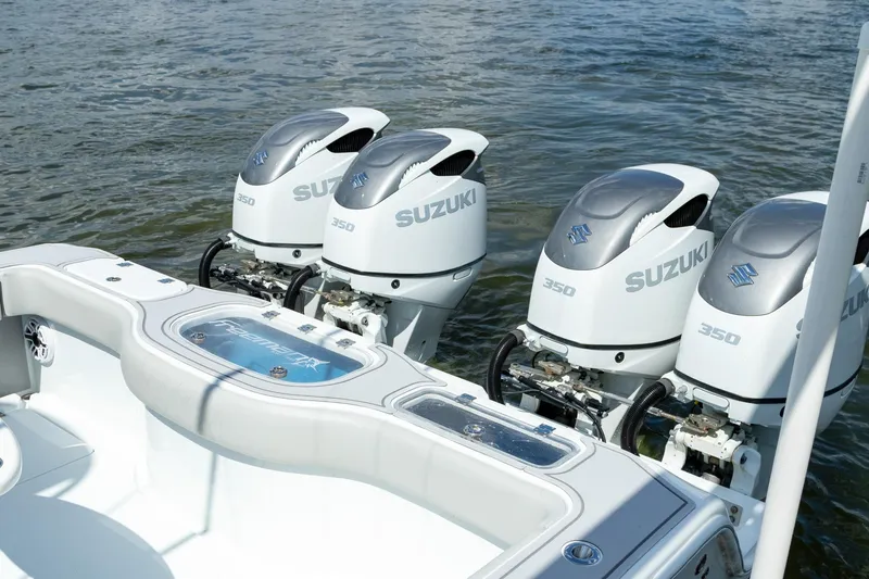 Slide: The Image of Four Suzuki 350 outboard engines on a 2022 Freeman 37 VH boat. - 49