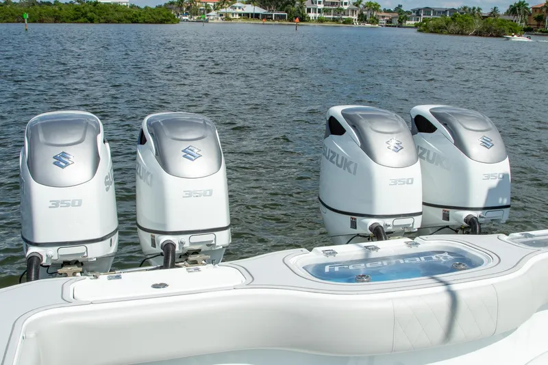 Slide: The Image of Four Suzuki 350 outboard motors on a 2022 Freeman 37 VH boat. - 5