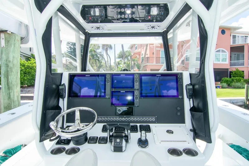 Slide: The Image of 2022 Freeman 37 VH boat cockpit with advanced navigation displays and controls. - 7