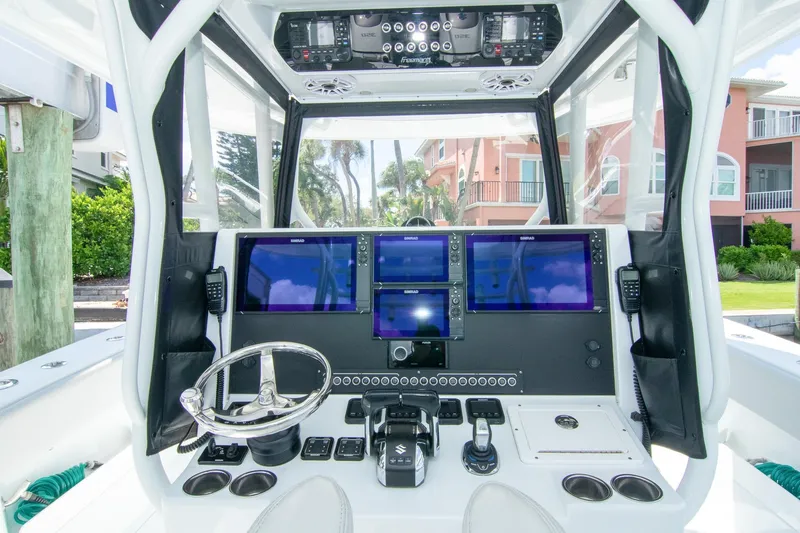 Slide: The Image of Cockpit of 2022 Freeman 37 VH boat with advanced navigation systems and controls. - 8