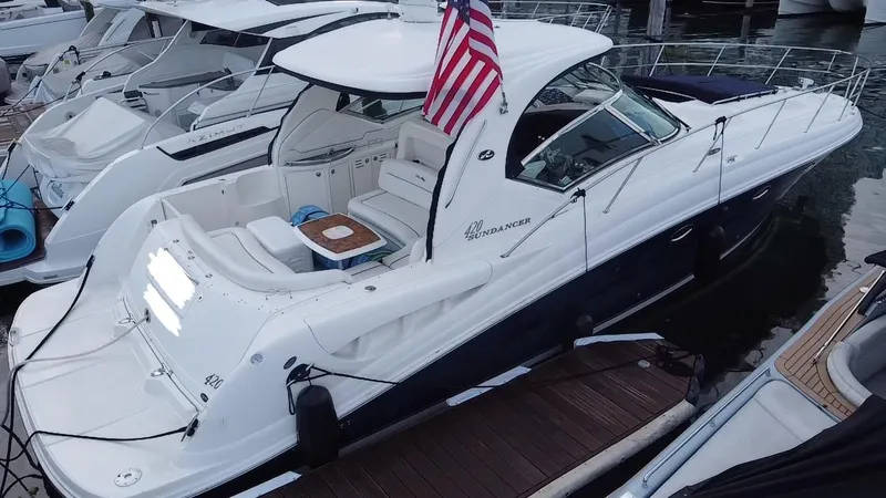 Slide: The Image of 2005 Sea Ray 420 Sundancer yacht docked at marina, rear view. - 12