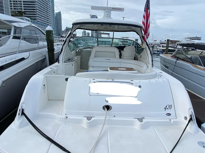 Slide: The Image of 2005 Sea Ray 420 Sundancer yacht docked at marina, rear view. - 14