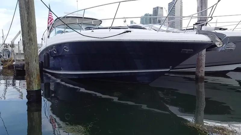 Slide: The Image of 2005 Sea Ray 420 Sundancer yacht docked at marina. - 2