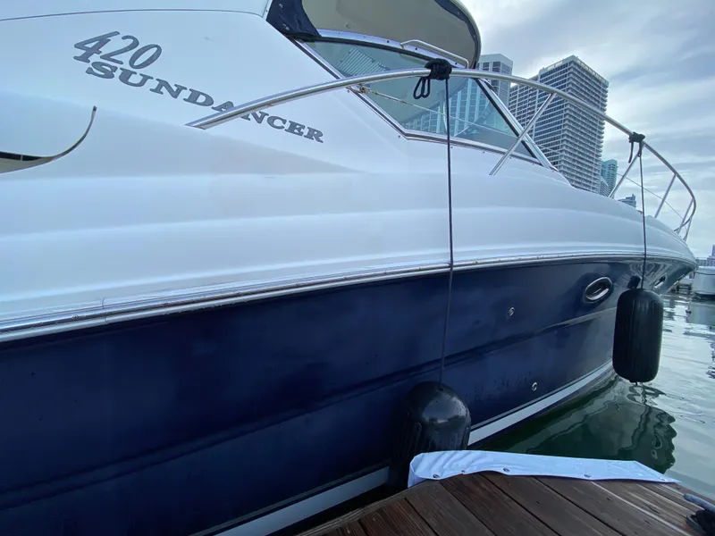 Slide: The Image of 2005 Sea Ray 420 Sundancer yacht docked at marina. - 20