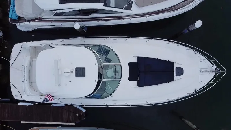 Slide: The Image of Top view of a 2005 Sea Ray 420 Sundancer yacht docked at a marina. - 21