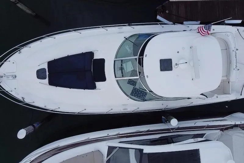 Slide: The Image of Top view of a 2005 Sea Ray 420 Sundancer docked at a marina. - 22
