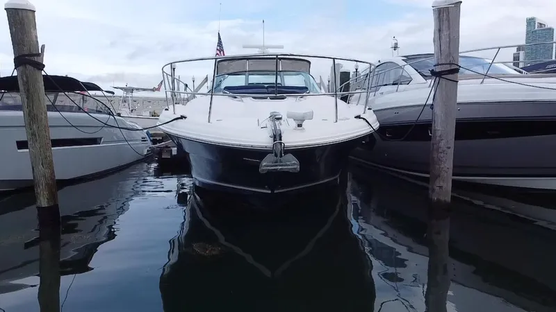Slide: The Image of 2005 Sea Ray 420 Sundancer docked between boats. - 7