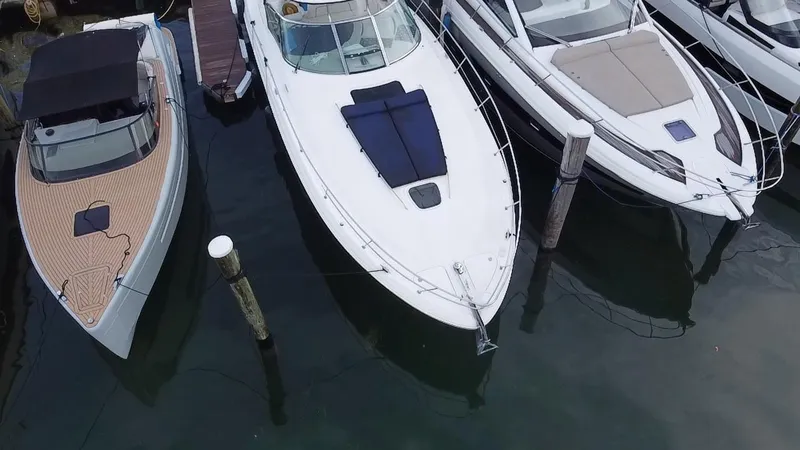 Slide: The Image of Aerial view of a 2005 Sea Ray 420 Sundancer docked among other boats. - 8