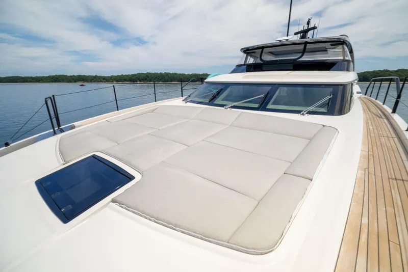 Slide: The Image of 2024 Sanlorenzo SL90A yacht with spacious sun deck and sleek design on calm waters. - 19