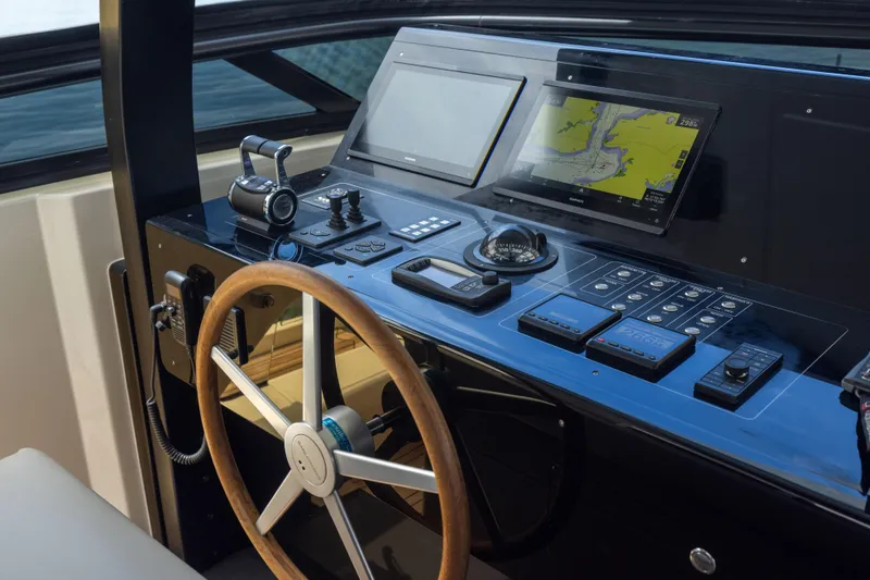 Slide: The Image of 2024 Sanlorenzo SL90A yacht helm with navigation screens and controls. - 30