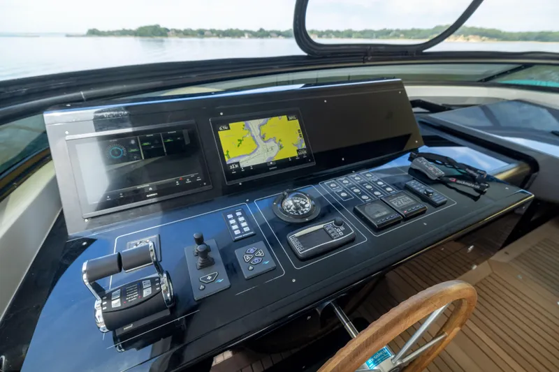Slide: The Image of 2024 Sanlorenzo SL90A yacht helm with advanced navigation controls and displays. - 32