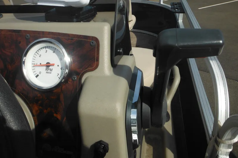 Slide: The Image of Control panel of 2024 Sun Tracker Bass Buggy 16 XL Select with switches for horn, lights, and aerator. - 14