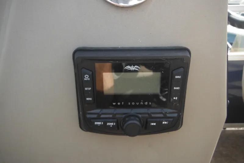 Slide: The Image of 2024 Sun Tracker Bass Buggy 16 XL Select pontoon boat with two seats and trolling motor. - 16