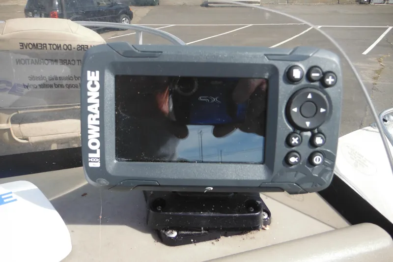 Slide: The Image of 2024 Sun Tracker Bass Buggy 16 XL Select capacity and safety warning labels. - 18