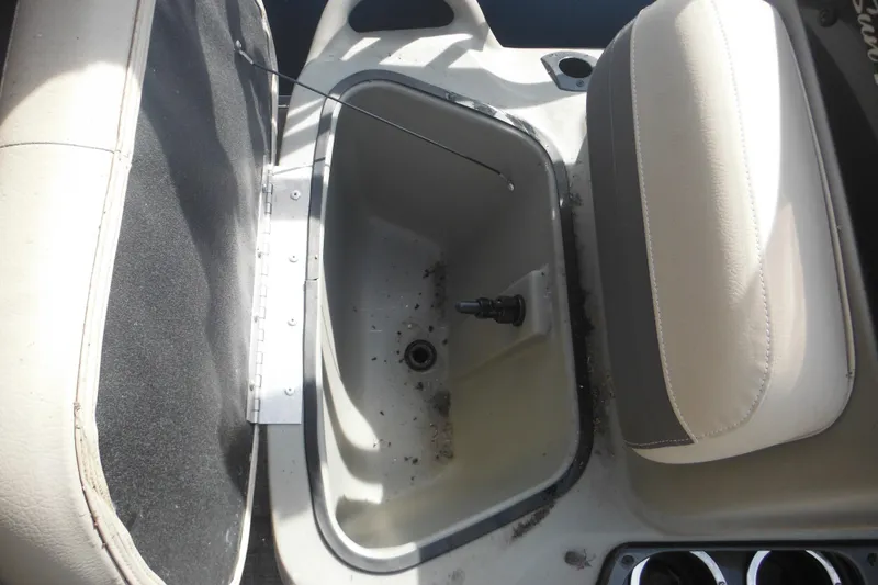 Slide: The Image of 2024 Sun Tracker Bass Buggy 16 XL Select boat ladder with chrome finish and wooden deck. - 22