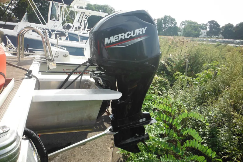 Slide: The Image of 2024 Sun Tracker Bass Buggy 16 XL Select trailer parked on pavement. - 31