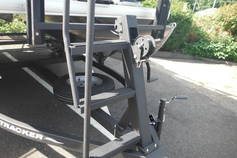Slide: The Image of Trailer hitch of 2024 Sun Tracker Bass Buggy 16 XL Select on asphalt. - 4