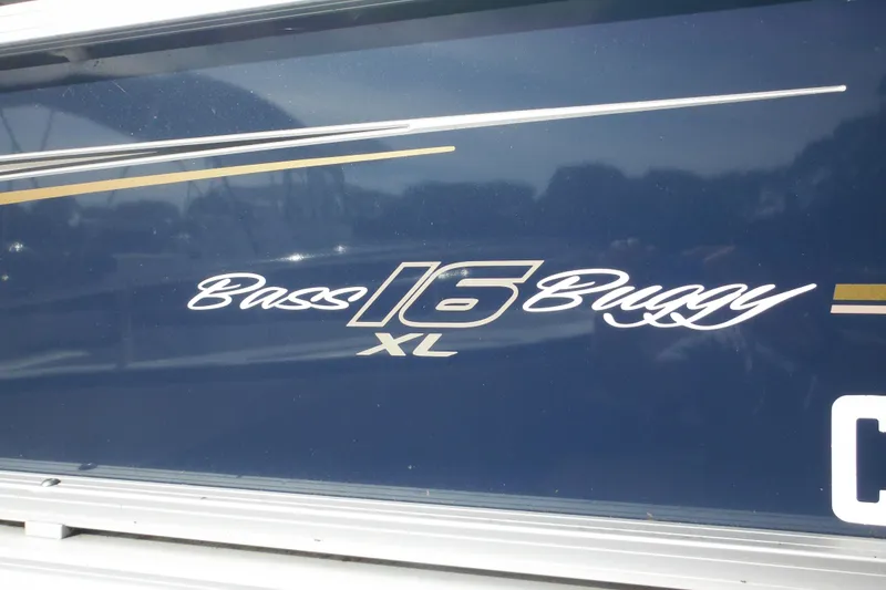 Slide: The Image of 2024 Sun Tracker Bass Buggy 16 XL Select pontoon boat, side view, with registration details. - 9