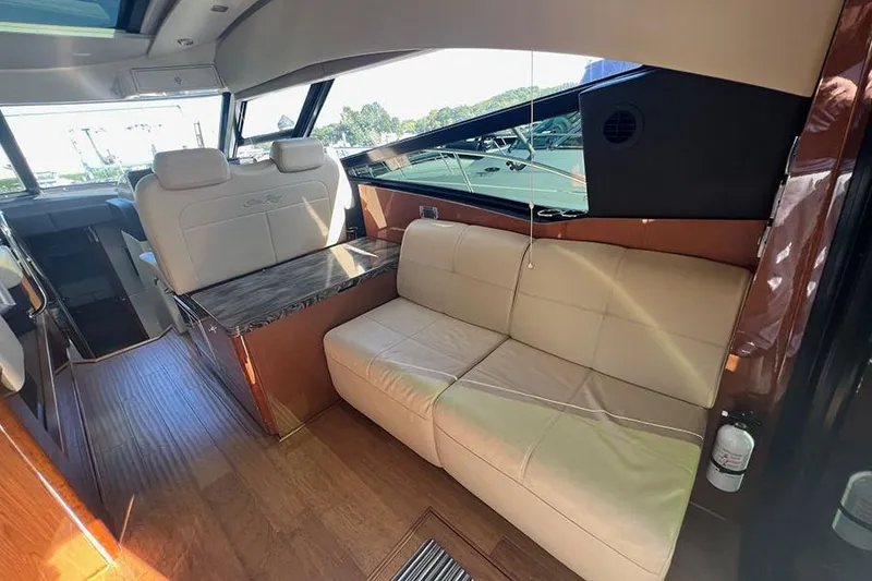 Slide: The Image of Luxurious interior of 2015 Sea Ray 470 Sundancer yacht with leather seating and wood accents. - 11