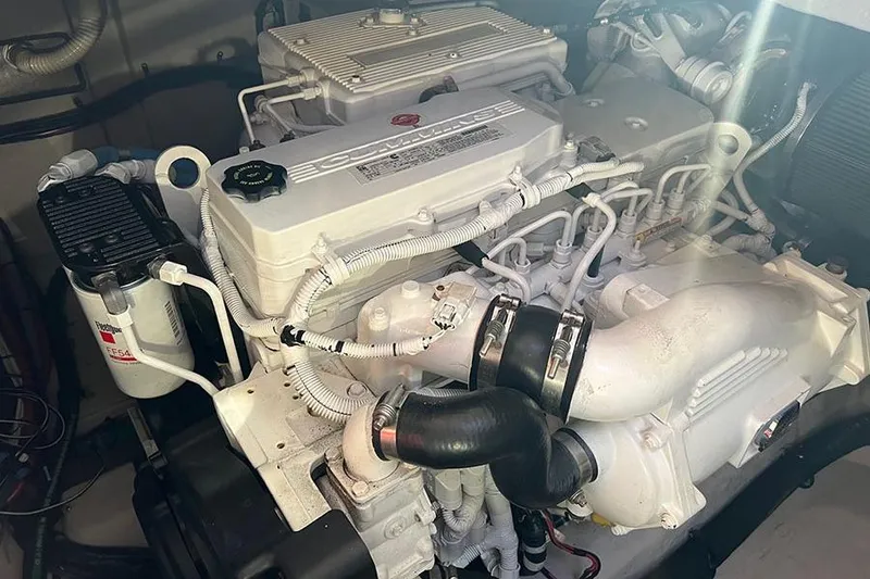 Slide: The Image of Engine of a 2015 Sea Ray 470 Sundancer yacht, showcasing intricate mechanical components. - 22