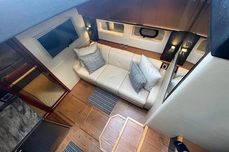 Slide: The Image of Luxurious interior of 2015 Sea Ray 470 Sundancer yacht with cozy seating and modern decor. - 25